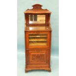 A Victorian walnut music cabinet, the mirrored top above a glazed door and pull-down cupboard,