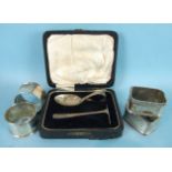 A baby's silver spoon and pusher, Sheffield 1929, cased, a pair of modern rectangular napkin