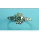A solitaire diamond ring claw-set an old brilliant-cut diamond of approximately 1.4cts, between