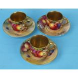 A pair of Royal Worcester porcelain coffee cans and saucers painted with fruit by Harry Ayrton,