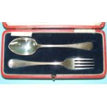 A christening spoon and fork in fitted case, Sheffield 1922 and a set of six coffee spoons in