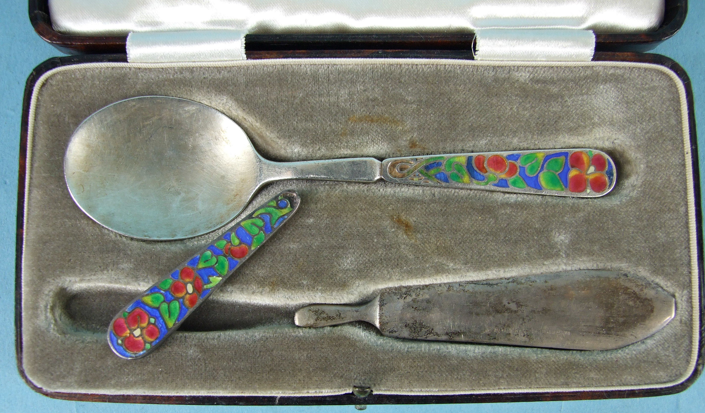 Bernard Instone, a cased Christening set consisting of a spoon and knife, the handles with red, - Image 2 of 3