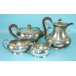 A four-piece silver tea service of plain oval compressed form, comprising teapot, sugar bowl,