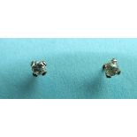 A pair of diamond ear studs, each old brilliant-cut diamond 0.12ct approximately, unmarked mounts.