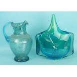 A Victorian bubble glass jug, pale blue colour, 27cm high and a 1960's mottled blue studio glass