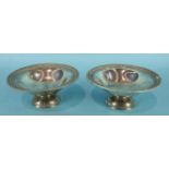 A pair of circular bonbon dishes of tazza form, with beaded rims, by Goldsmiths & Silversmiths Co.