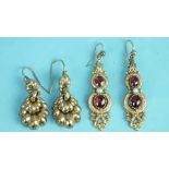 A pair of Victorian pendant earrings each set two foiled cabochon garnets and a pearl, (one