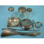 Three early-20th century pierced bonbon dishes, a silver-handled button hook and shoe horn and other