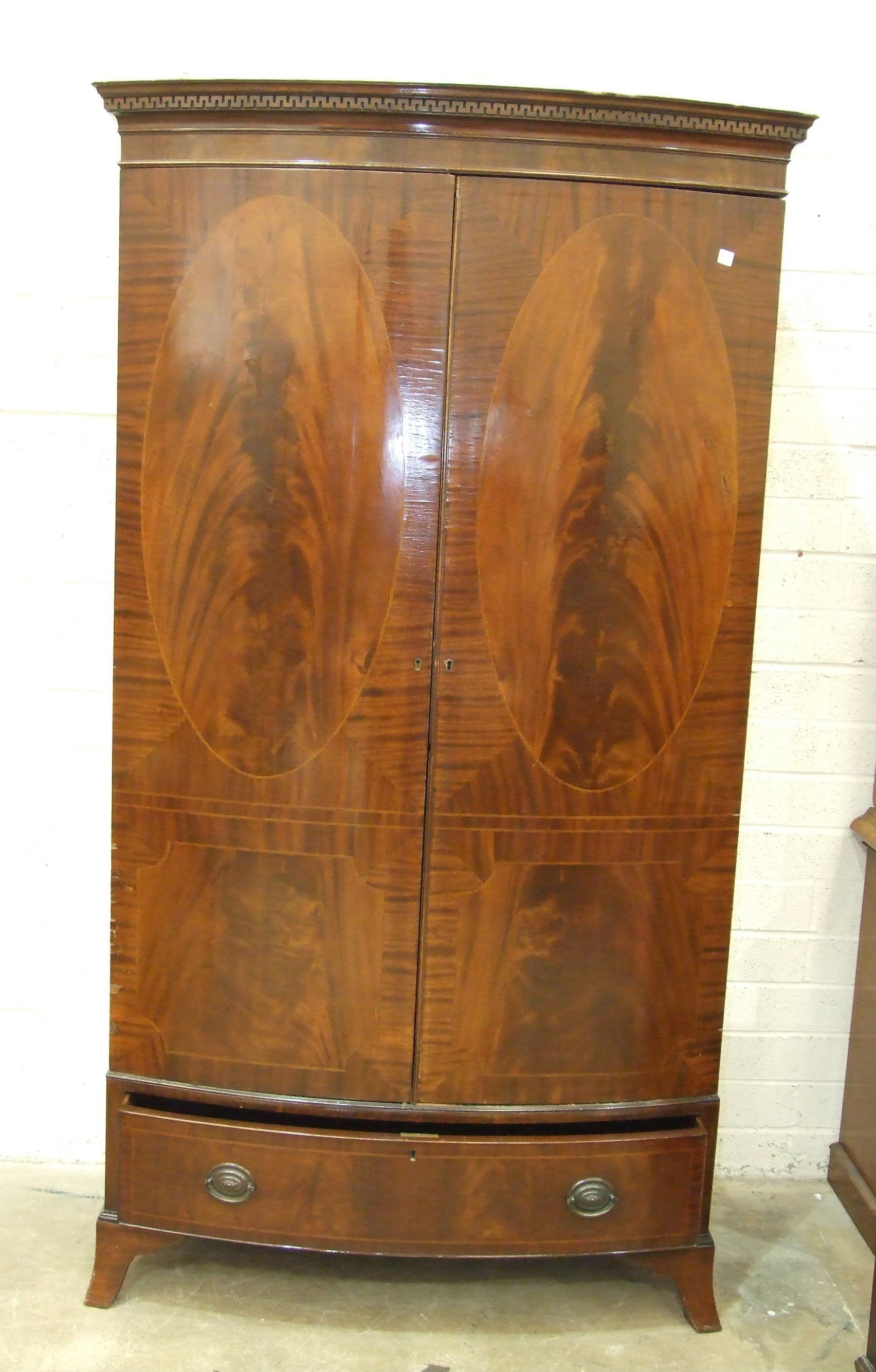 A Georgian-style mahogany bow-fronted two-door wardrobe, with dentil cornice and base drawer, - Image 2 of 2