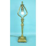 A brass Pullman railway lamp of square pedestal form, with heavy loading to the base, stamped with