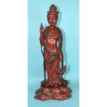 A large Chinese carved and lacquered wood figure of a standing Guanyin on a mound base, 20th