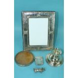 A modern rectangular embossed photograph frame, 19 x 15cm, a small circular silver photograph frame,