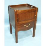 A Georgian mahogany tray-top commode of slightly-bowed shape, with tambour cupboard, on square