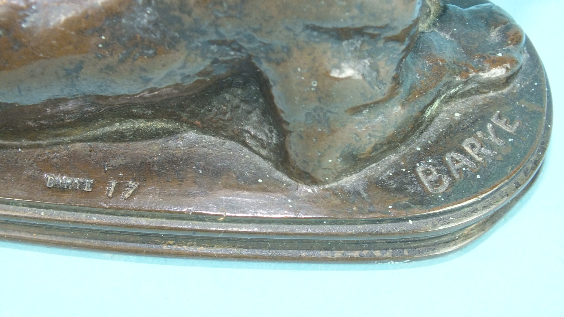 After Antoine-Louis Barye, a bronze study of a lioness lying down, on shallow reeded-edge plinth, - Image 2 of 2