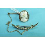 A shell cameo ring carved in high relief with the bust of a young woman with fruit in her hair, on