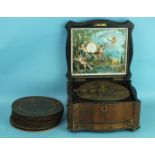A Victorian walnut Polyphon music box playing 8¼" discs, single comb in good order, 38cm wide,