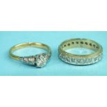 An 18ct gold and platinum ring set a brilliant-cut diamond in illusion setting, size J½, 2.6g and