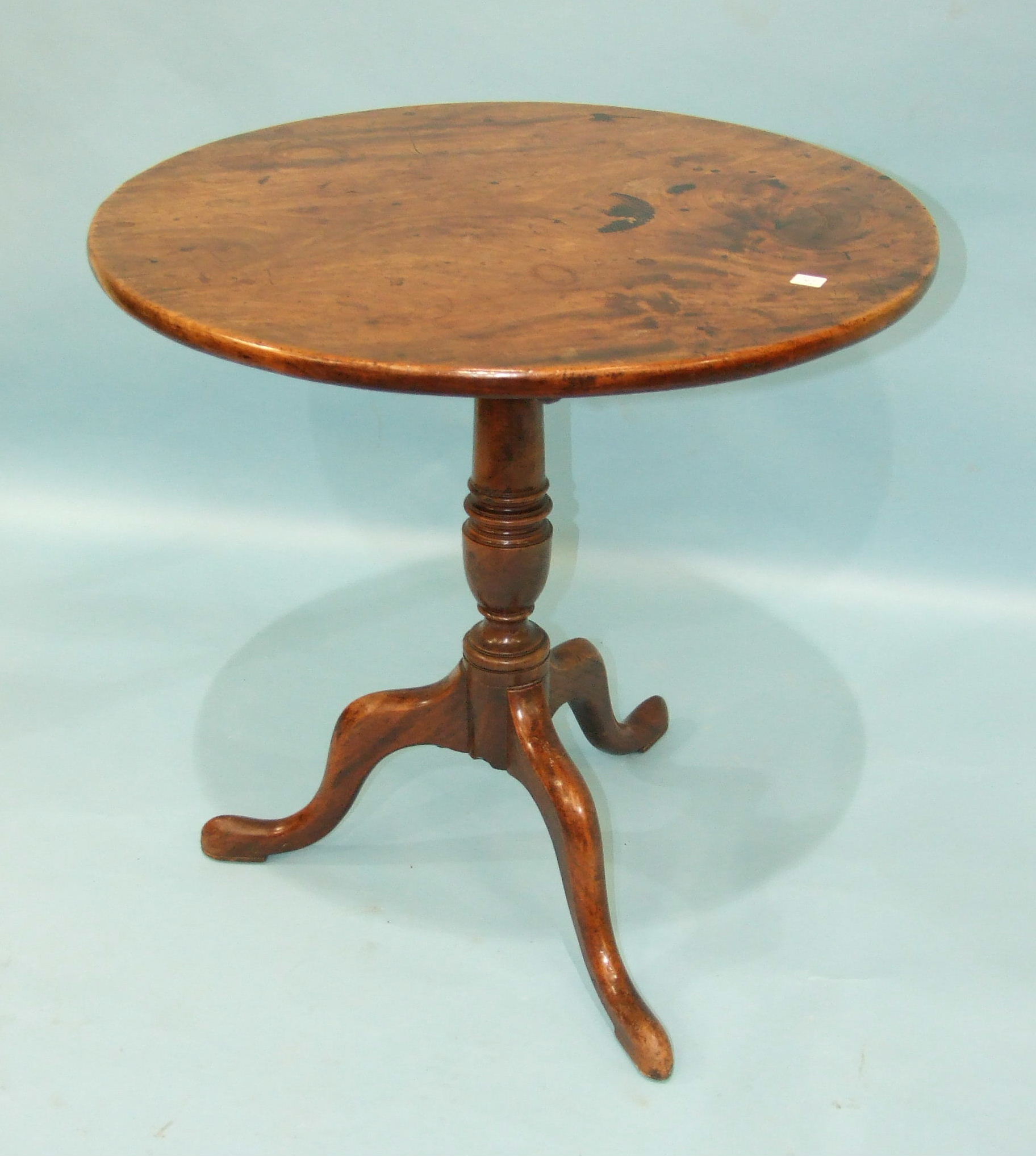 A Georgian mahogany circular tilt-top table with turned stem and cabriole tripod, 72cm diameter, (