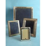 A modern rectangular photograph frame stamped .925, 30 x 25cm and three smaller frames, (4).