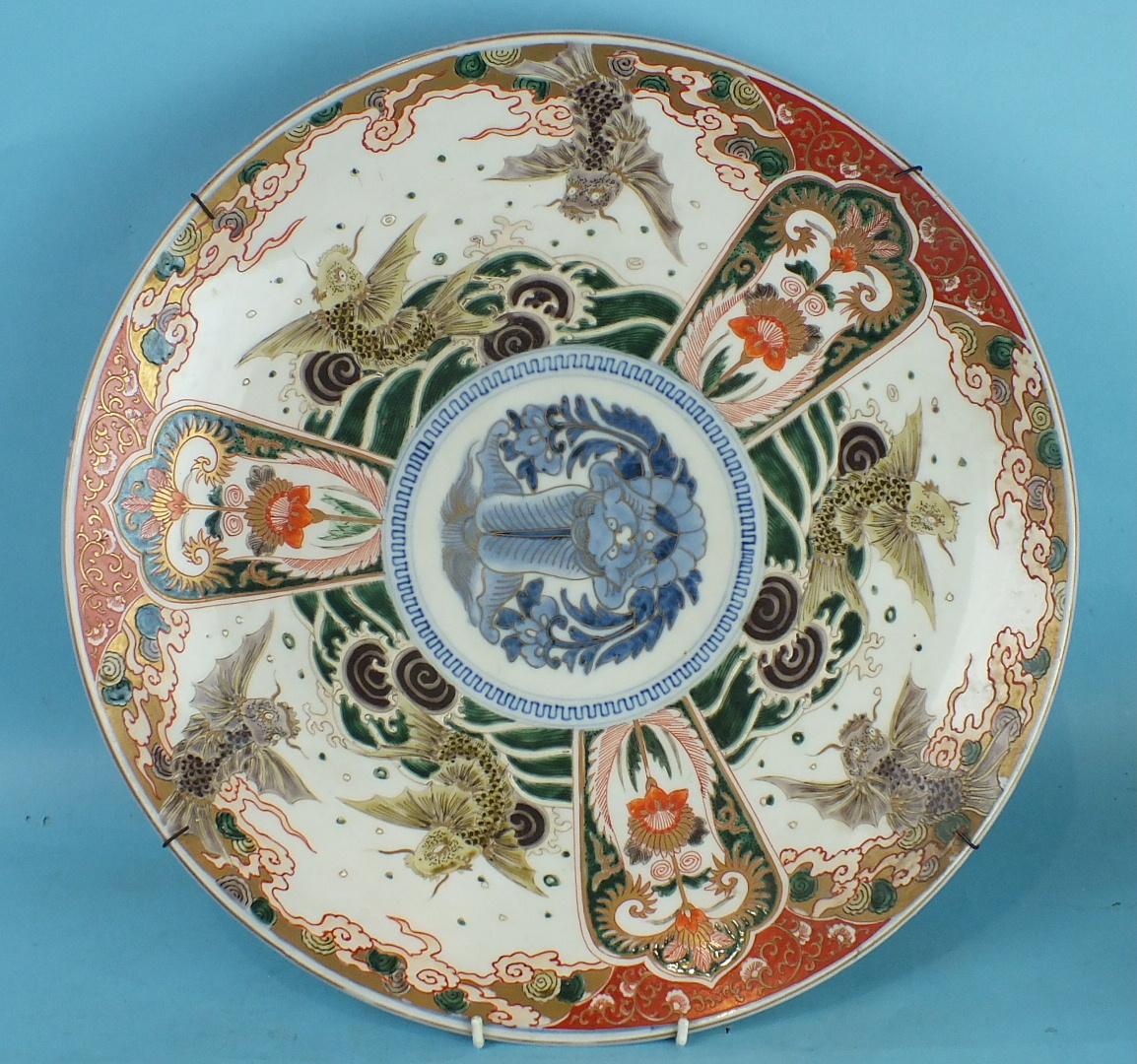A 19th century Japanese Imari charger decorated with flying fish above waves, blue dragon to centre, - Image 2 of 5