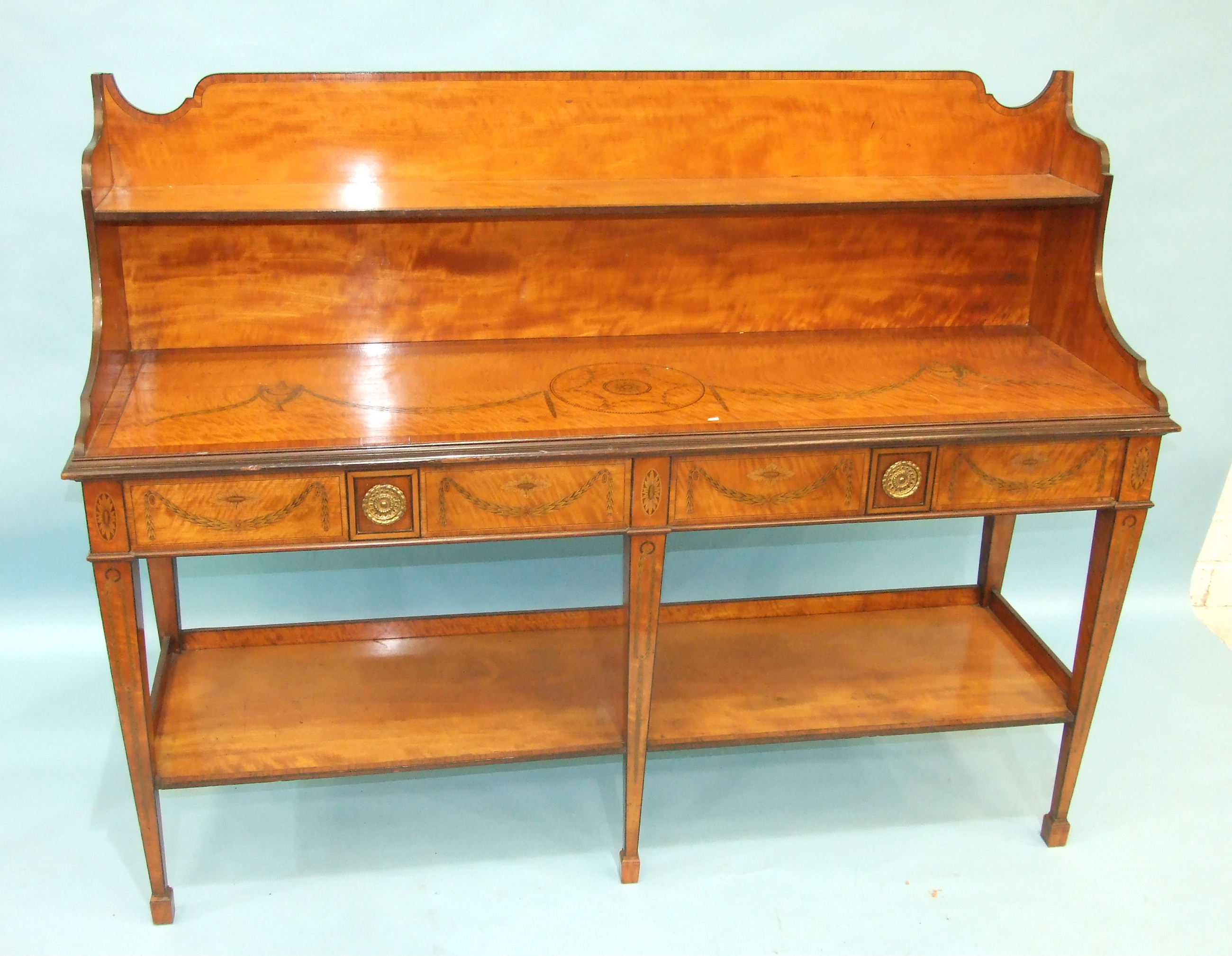 An inlaid and cross-banded satinwood serving table in the Adam taste, the low shelved back above a