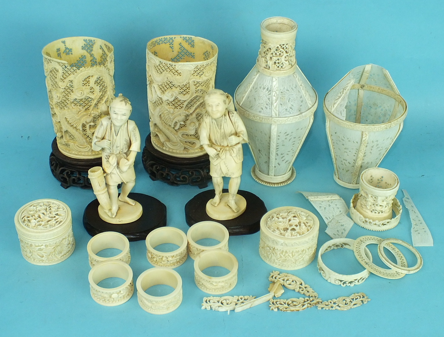 A box of 19th century Chinese and Japanese ivory items, including a pair of lantern vases, 20cm
