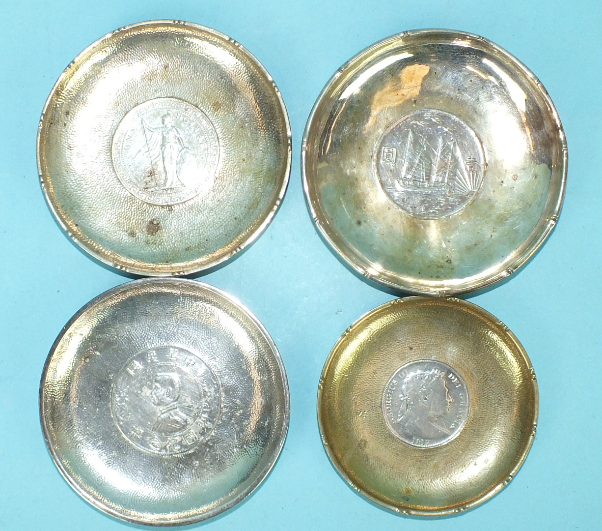 A Chinese beaten silver circular pin tray centred by a memento coin, "Birth of the Republic of