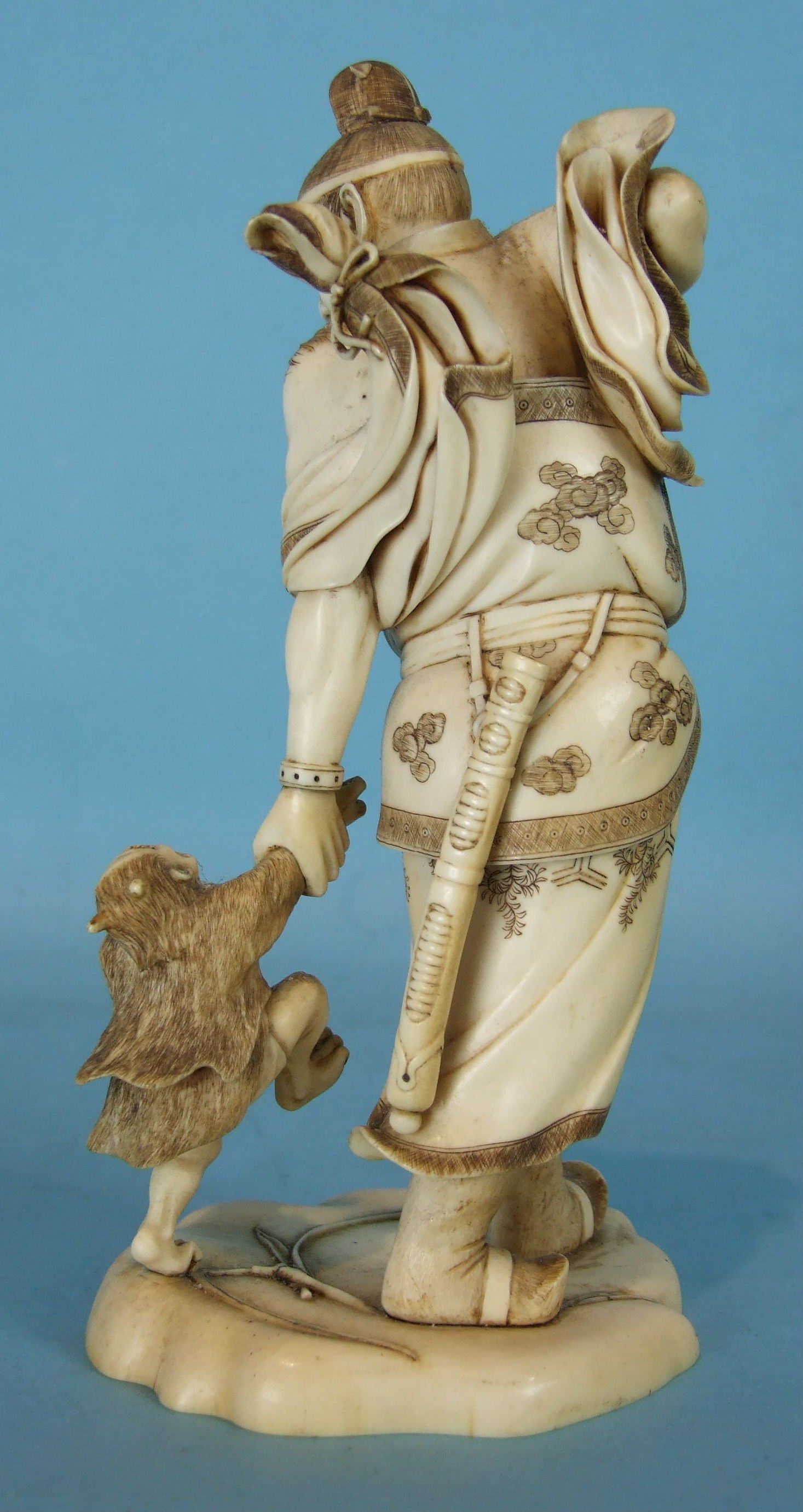 A Japanese ivory okimono of Shoki the demon slayer capturing a young oni, slight damage to - Image 2 of 4