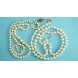 A string of uniform cultured pearls with gold clasp, 53cm long and a string of graduated cultured