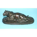 After Antoine-Louis Barye, a bronze study of a lioness lying down, on shallow reeded-edge plinth,
