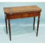 A late-Georgian mahogany tea table, the rectangular reeded fold-over top with rounded corners, on