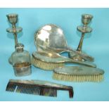 A 1920's silver-backed hand mirror, two brushes and other items.