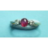 A ruby and diamond ring claw-set a cabochon ruby between two old brilliant-cut diamonds in 18ct gold