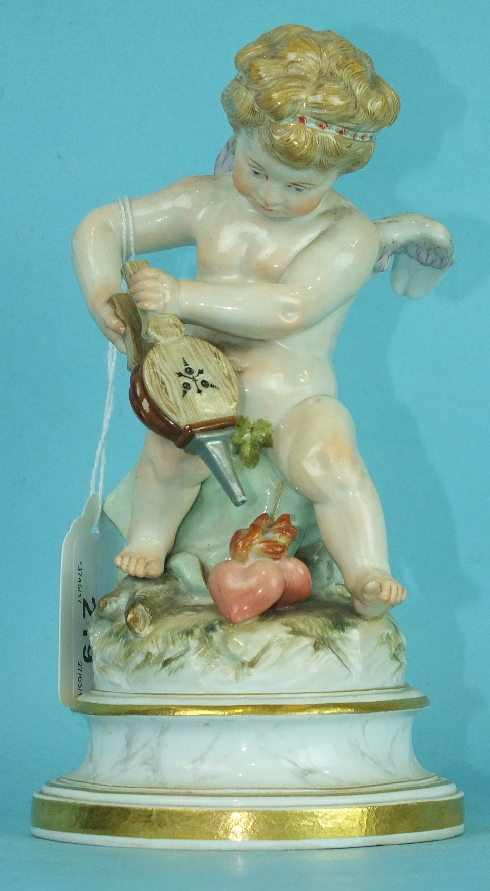 A 19th century Meissen porcelain figure of a winged cherub lighting the flaming heart with his - Image 2 of 4