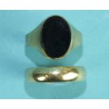 A 9ct gold wedding band, size X, 5.3g and a 9ct gold signet ring set onyx, size W, 3.1g, (2).