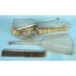 An Art Deco hand mirror, two brushes and comb, Birmingham 1934 and an oval-lidded cut-glass