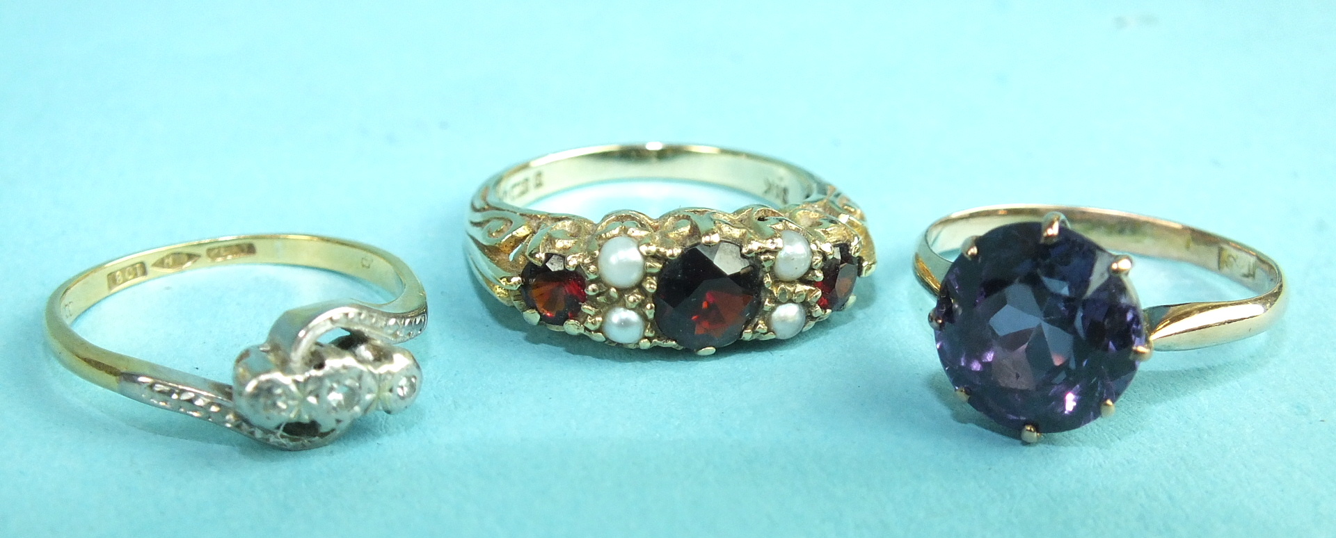 A yellow gold ring set synthetic sapphire, size M, a 9ct gold Victorian-style ring set garnets and