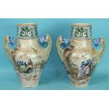 A pair of French earthenware vases in Quimper style decorated with a mother and children,