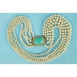 A necklace of five strands of simulated pearls to a large turquoise cabochon-set box clasp with