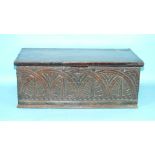 An antique carved oak lidded box, with hinged lid and carrying handles, 53 x 29cm, 20.5cm high.