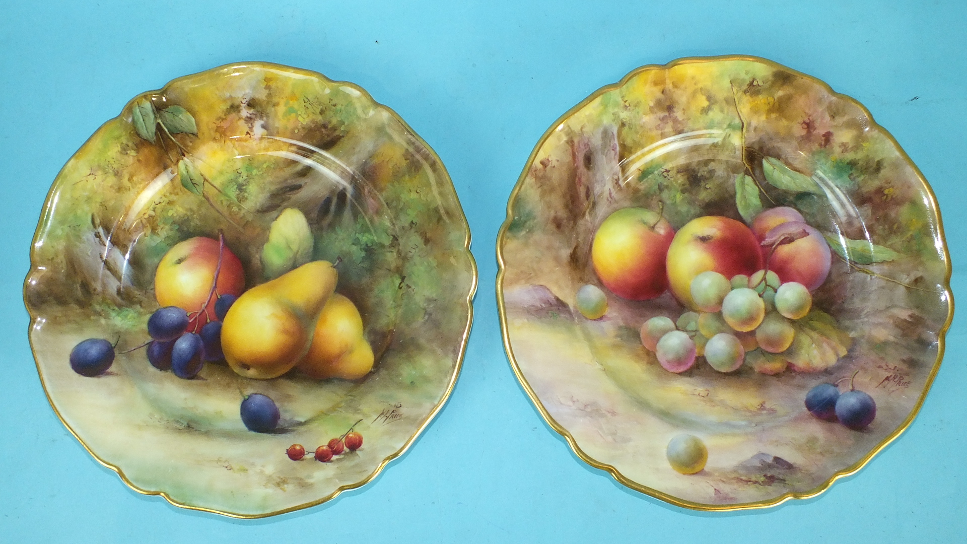 A pair of Royal Worcester porcelain fruit-decorated plates painted by Horace Price, date codes for