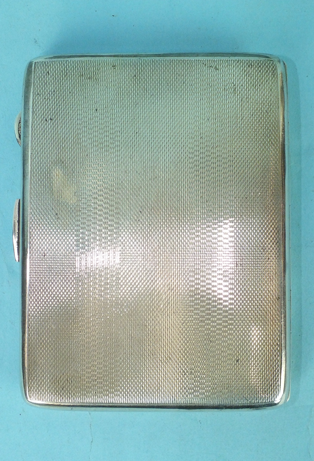 An engine-turned silver cigarette case, Birmingham 1946, 11 x 8.5cm, engraved initials outside, - Image 2 of 3