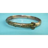 A 9ct gold hinged belt bangle, (a/f), 8.7g.