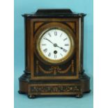 A 19th century walnut and mahogany mantel clock with circular enamelled dial and drum movement, 27cm