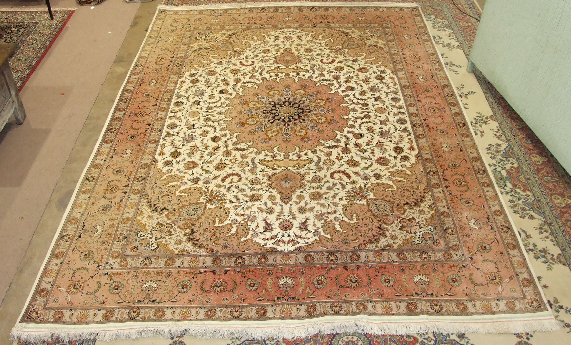 A modern Tabriz pattern 'medallion' design wool carpet, the design on ivory and salmon pink - Image 2 of 3