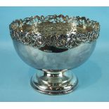 An Edwardian silver rose bowl with pierced iris border, standing on a circular base, Sheffield 1904,