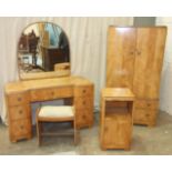 A satinwood gentleman's wardrobe, matching dressing chest, stool and bedside cupboard in the Art