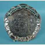A George II circular visiting card tray with embossed central decoration and shell piecrust