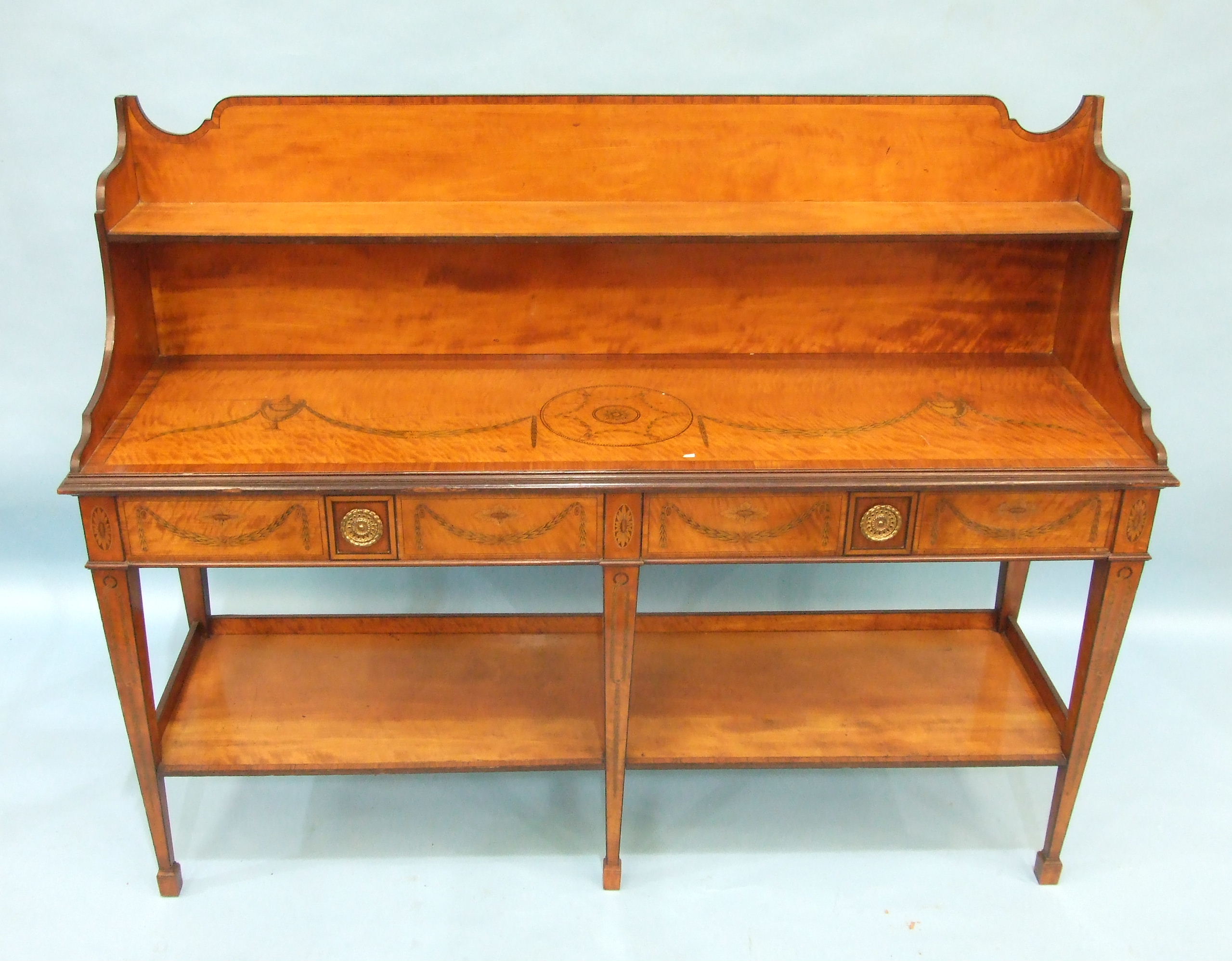 An inlaid and cross-banded satinwood serving table in the Adam taste, the low shelved back above a - Image 2 of 4