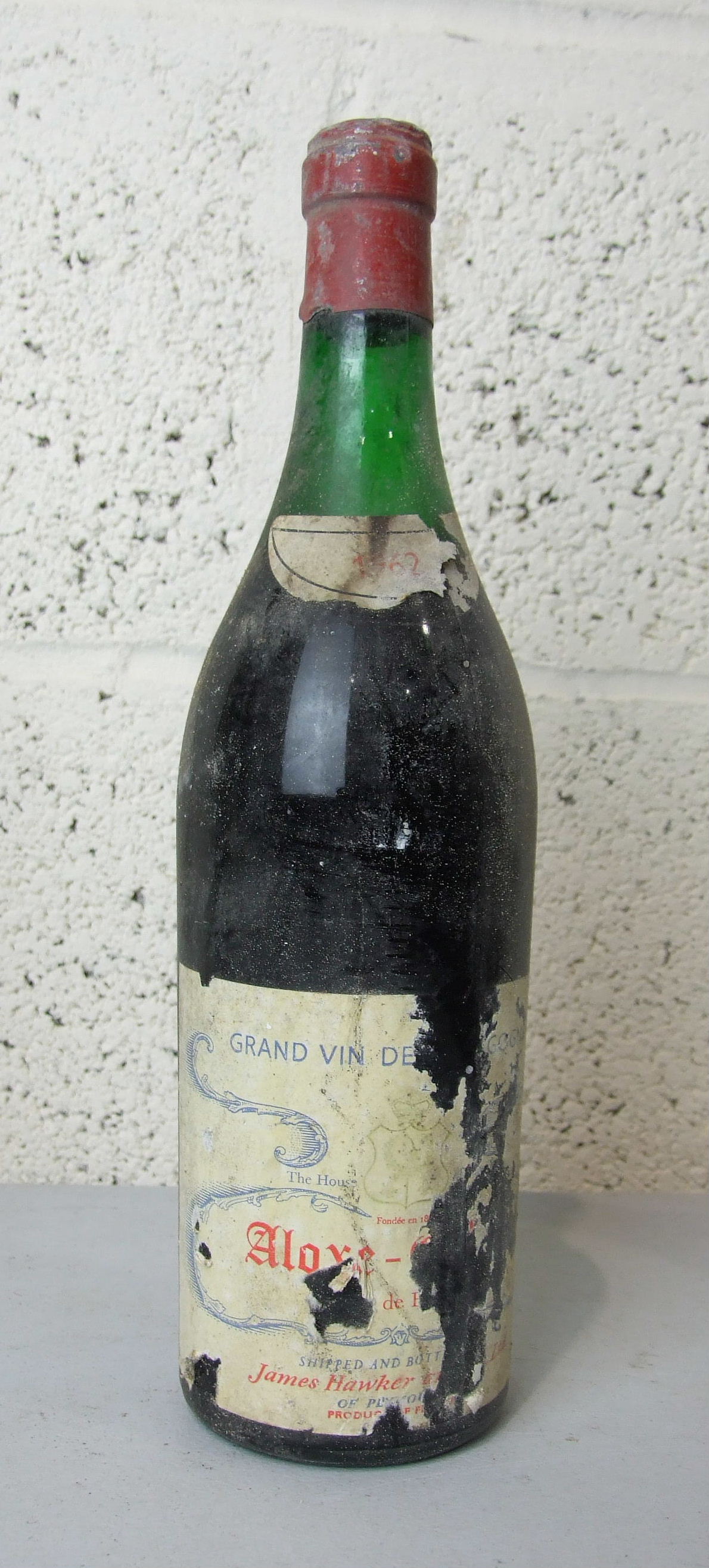 France, Aloxe Corton Grand Vin de Bourgogne 1962, high shoulder, shipped and bottled by James Hawker